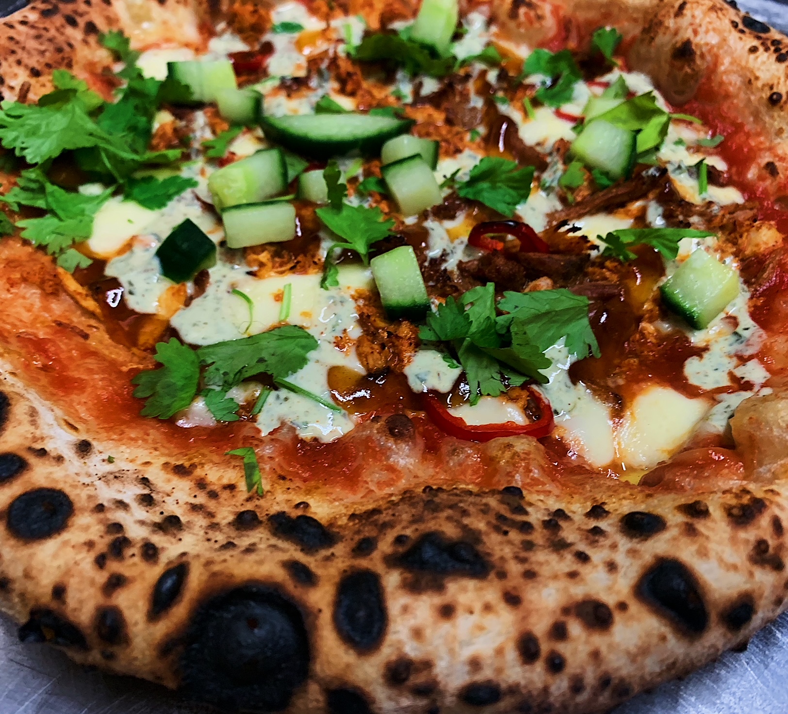 Spiced lamb pizza with cucumber and coriander